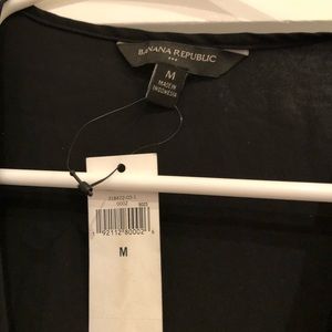 Banana republic black ruffle short sleeved shirt.